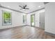 Large bedroom has two windows, ceiling fan and door to outdoor space at 632 Hunters Cove Ln., Loganville, GA 30052