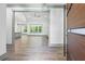 The foyer offers a glimpse into the living room and features hardwood floors and elegant white trim at 632 Hunters Cove Ln., Loganville, GA 30052