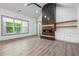 Bright living area with a fireplace feature and large windows at 632 Hunters Cove Ln., Loganville, GA 30052