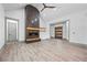Open living space with a fireplace and a view into the entryway at 632 Hunters Cove Ln., Loganville, GA 30052
