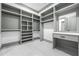 Spacious walk-in closet equipped with shelving, drawers, and a vanity area at 632 Hunters Cove Ln., Loganville, GA 30052