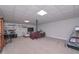 Spacious basement area with neutral carpet flooring, an entertainment area, and a unique square ceiling at 7533 Mason Falls Dr, Winston, GA 30187