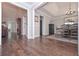 Open-concept dining room with hardwood floors and access to multiple rooms at 7533 Mason Falls Dr, Winston, GA 30187