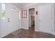 Bright foyer featuring hardwood floors, a decorative front door and access to the bathroom at 7533 Mason Falls Dr, Winston, GA 30187