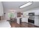 Open concept kitchen with stainless appliances and adjacent breakfast nook at 7533 Mason Falls Dr, Winston, GA 30187