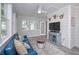 Bright sunroom featuring a ceiling fan and stylish decor at 7533 Mason Falls Dr, Winston, GA 30187