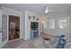 Inviting sunroom with white ceiling and trim, vinyl flooring, and deer mounts above the tv at 7533 Mason Falls Dr, Winston, GA 30187