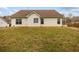 View of the house's backyard with ample lawn space at 105 Hunters, Mcdonough, GA 30253