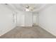 Main bedroom with recessed ceiling, neutral carpet, and ensuite bathroom access at 105 Hunters, Mcdonough, GA 30253