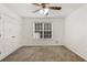 Bedroom featuring neutral walls, carpet, closet, and a ceiling fan at 105 Hunters, Mcdonough, GA 30253