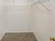 Walk-in closet with ample shelving and carpeted floor at 105 Hunters, Mcdonough, GA 30253