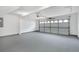 Spacious garage with concrete floor and automatic door at 105 Hunters, Mcdonough, GA 30253