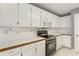Bright kitchen featuring white cabinets, countertops, and stainless steel appliances at 105 Hunters, Mcdonough, GA 30253