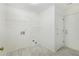Laundry room featuring tile flooring, shelves, and a door to the exterior at 105 Hunters, Mcdonough, GA 30253
