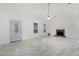 Bright living room showcasing a brick fireplace, and light tile flooring throughout at 105 Hunters, Mcdonough, GA 30253