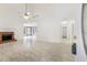 Bright living room with white walls, tile floors, and a cozy brick fireplace at 105 Hunters, Mcdonough, GA 30253