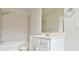 Well-lit bathroom with modern fixtures and a tiled tub at 1122 Provence Ln, Decatur, GA 30033