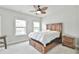 Comfortable bedroom with hard wood bed frame and natural light at 1122 Provence Ln, Decatur, GA 30033