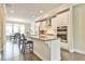 Modern kitchen with white cabinetry, stainless steel appliances, and a large center island at 1122 Provence Ln, Decatur, GA 30033