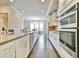 This modern kitchen features stainless steel appliances, an island, and plenty of storage space at 1122 Provence Ln, Decatur, GA 30033