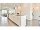 Open-concept kitchen featuring a large island with white cabinets and a view into the living room at 1122 Provence Ln, Decatur, GA 30033