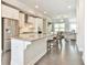 Spacious kitchen with white cabinets, stainless steel appliances, and view to living room at 1122 Provence Ln, Decatur, GA 30033
