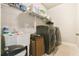 Convenient laundry room with washer, dryer, sink, and ample storage space at 1122 Provence Ln, Decatur, GA 30033