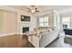 Bright living room offering hardwood floors, a fireplace, and a mounted television at 1122 Provence Ln, Decatur, GA 30033