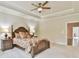 Relaxing main bedroom suite features trey ceilings, large bed, bedside tables, and plenty of space at 1122 Provence Ln, Decatur, GA 30033