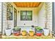 Covered patio with potted plants and outdoor seating at 1122 Provence Ln, Decatur, GA 30033