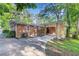 A charming brick home with a covered porch and mature trees in the backyard at 1461 Alverado Way, Decatur, GA 30032