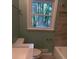 Stylish bathroom with updated fixtures, tiled shower, and window for natural light at 1461 Alverado Way, Decatur, GA 30032