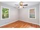 Bedroom boasts hardwood floors and ample natural light from two large windows at 1461 Alverado Way, Decatur, GA 30032