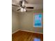 Simple bedroom with hardwood floors and bright window at 1461 Alverado Way, Decatur, GA 30032