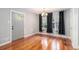 Dining room with hardwood floors, modern lighting, and a gray exterior door at 1461 Alverado Way, Decatur, GA 30032