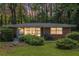 Charming brick home with lush front yard and ample natural light through large windows at 1461 Alverado Way, Decatur, GA 30032