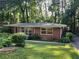 Beautiful brick home with mature landscaping, offering a peaceful and inviting curb appeal at 1461 Alverado Way, Decatur, GA 30032