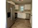 Modern kitchen featuring stainless steel appliances, white cabinets, and sleek countertops at 1461 Alverado Way, Decatur, GA 30032