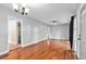 Spacious living room with hardwood floors, fan and a large cased opening at 1461 Alverado Way, Decatur, GA 30032