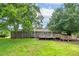 Spacious backyard with a large wooden deck perfect for outdoor entertaining and relaxation at 1810 King Mill Rd, Mcdonough, GA 30252