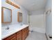 Spacious bathroom with dual sinks, a large mirror and a shower-tub combo at 1810 King Mill Rd, Mcdonough, GA 30252