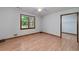 Bedroom with wood-look floors, closet, and natural light from the window at 1810 King Mill Rd, Mcdonough, GA 30252