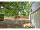 Spacious driveway leading to the garage, partially shaded by a mature tree at 1810 King Mill Rd, Mcdonough, GA 30252