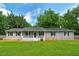 Charming single-story home with inviting front porch and well-maintained lawn at 1810 King Mill Rd, Mcdonough, GA 30252
