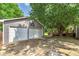 Detached two-car garage with an adjacent deck and ample parking space at 1810 King Mill Rd, Mcdonough, GA 30252