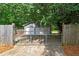 A detached two-car garage with a gated entrance at 1810 King Mill Rd, Mcdonough, GA 30252