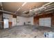 Spacious garage with work space, storage and doors on both ends at 1810 King Mill Rd, Mcdonough, GA 30252