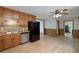 Kitchen boasts stainless steel dishwasher, wood cabinets, and an adjacent dining area at 1810 King Mill Rd, Mcdonough, GA 30252