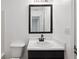 Well-lit bathroom featuring a stylish vanity, sink, and framed mirror at 1823 Devon Dr # 1823, Atlanta, GA 30311