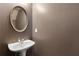 Bathroom featuring a pedestal sink and oval mirror at 1823 Devon Dr # 1823, Atlanta, GA 30311